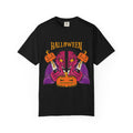 Black t-shirt with Halloween-themed design featuring a jack-o'-lantern and purple robe on a white background.