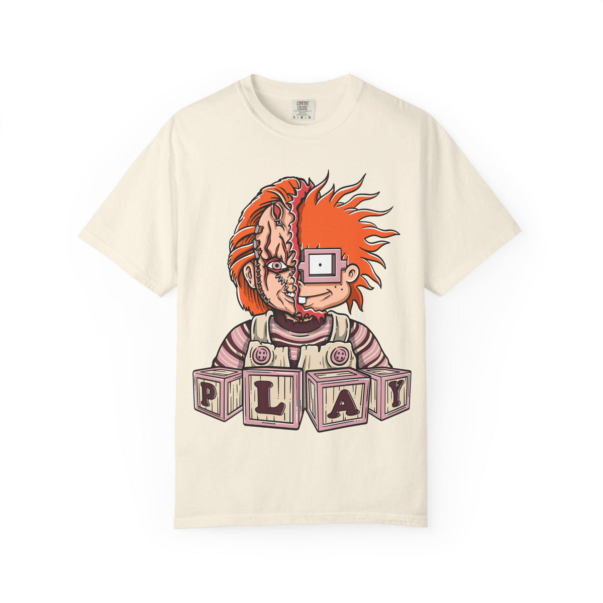 Beige t-shirt with a graphic design of a character with red hair and 'PLAY' blocks on a white background