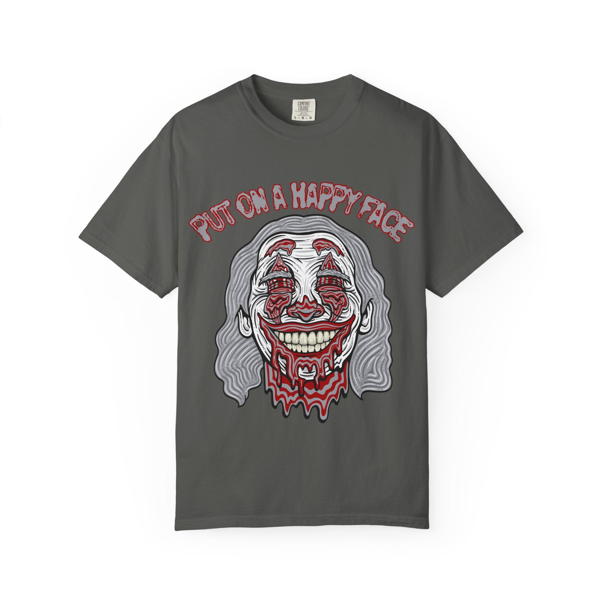 Gray t-shirt with a graphic design of a clown face and text 'Put on a happy face' on a white background