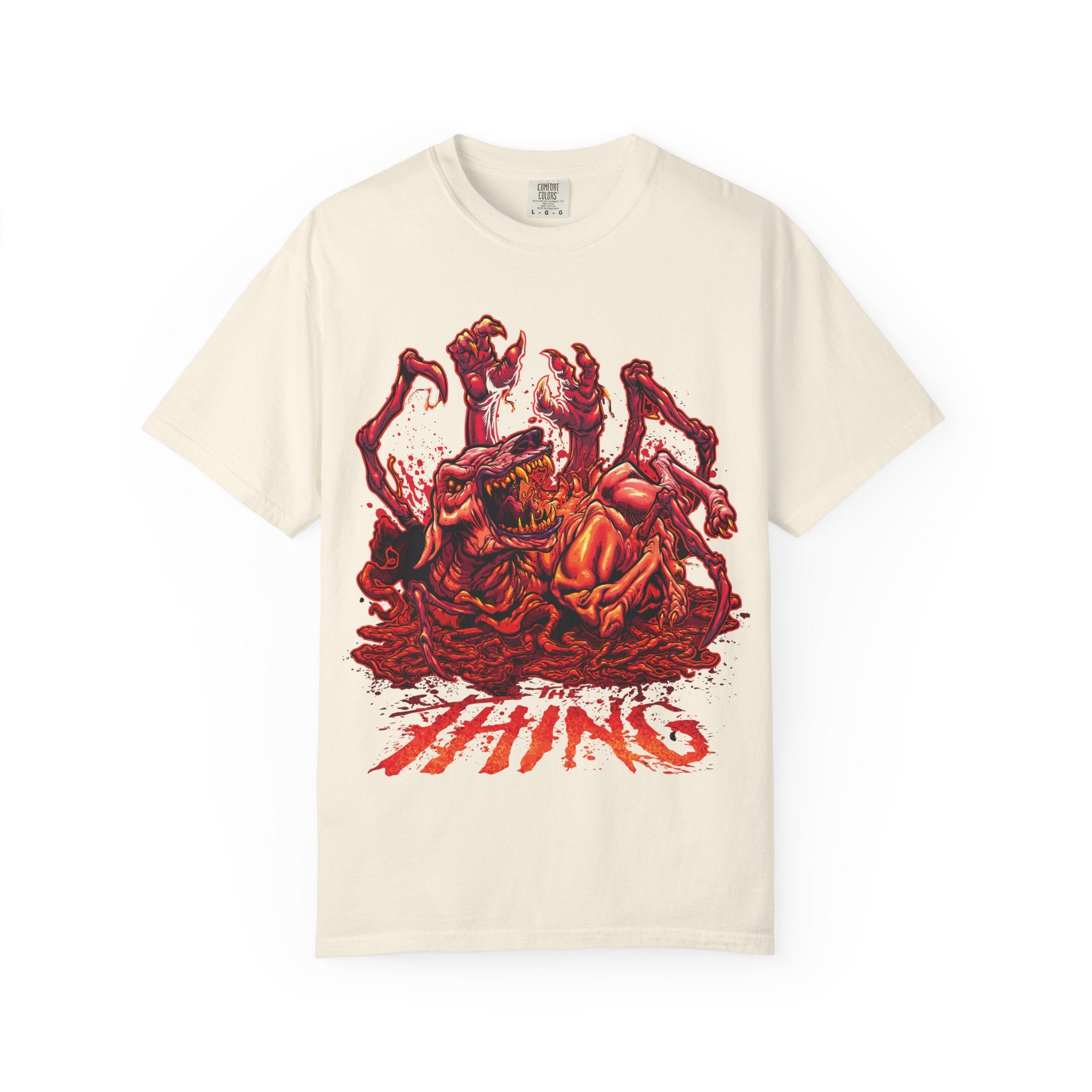 Beige t-shirt with The Thing red graphic design and text on a white background