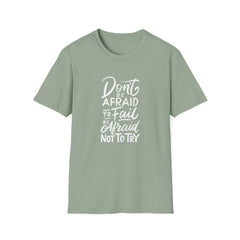 Sage green t-shirt with motivational quote on a white background