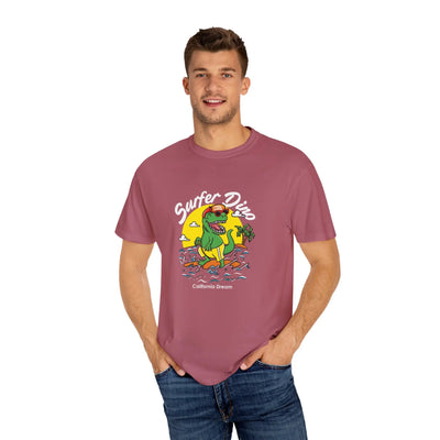 California Dream Surfing Dinosaur In Waves With Palm Tree Graphic T-Shirt - Sinful Threads