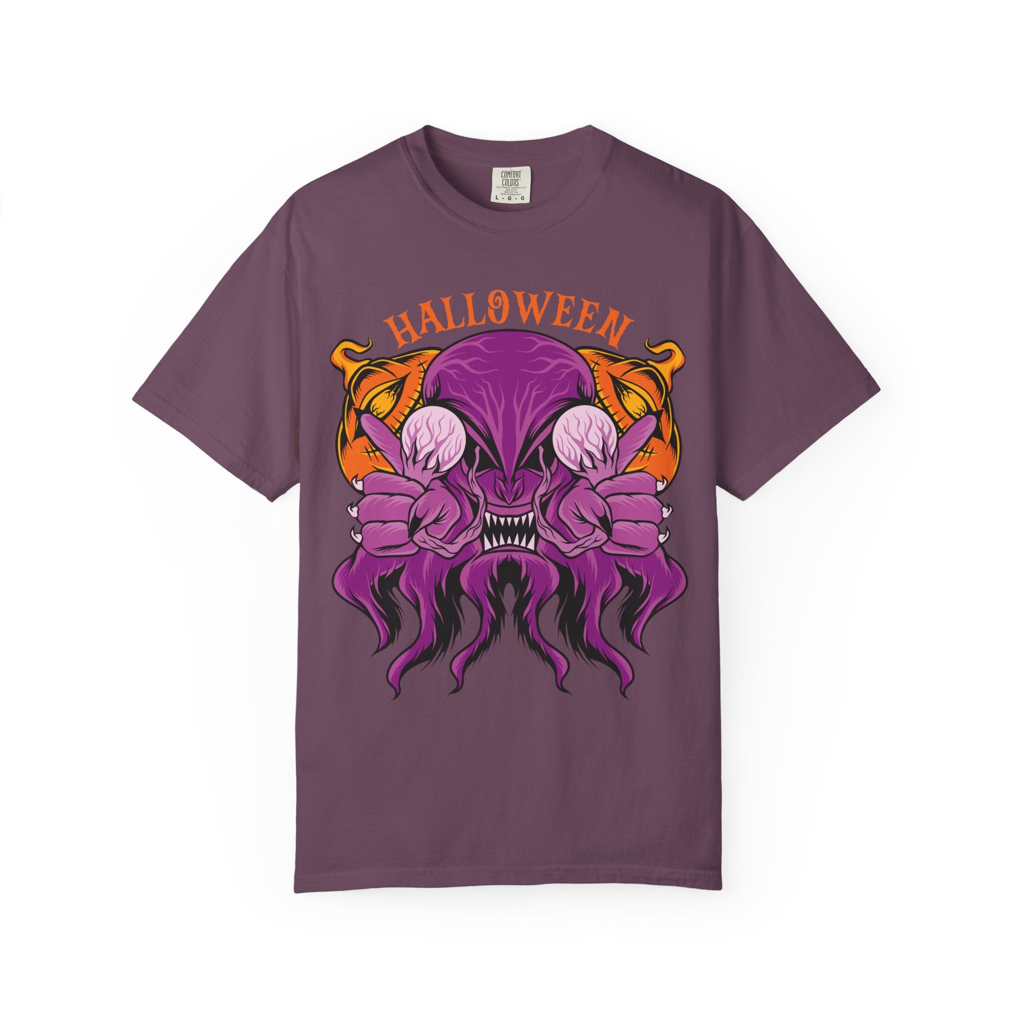 Purple t-shirt with a Halloween-themed design featuring an alien and pumpkins on a white background.